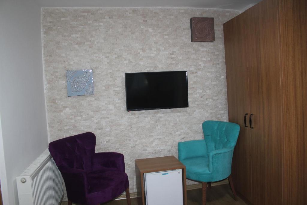 TV a/nebo společenská místnost v ubytování Masal Hotel