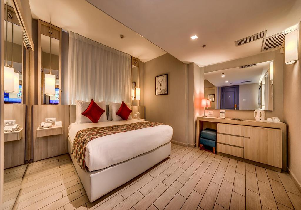 Postel nebo postele na pokoji v ubytování Astral Maris Hotel