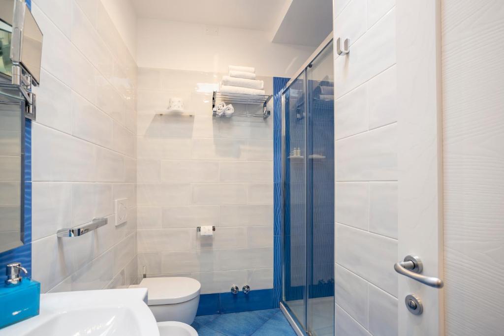 a bathroom with a shower and a toilet and a sink at Casa Vacanze Parco Del Generale in Ischia