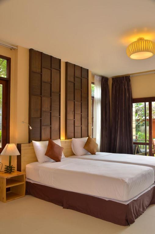 a bedroom with a large bed in a room at Palm Leaf Resort Koh Tao in Ko Tao