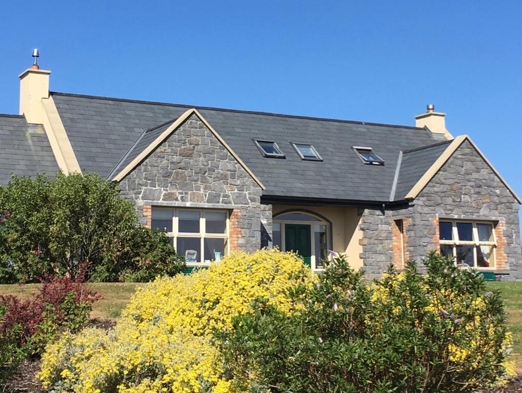a house with a gray roof at Atlantic Garden Lodge in Lisdoonvarna
