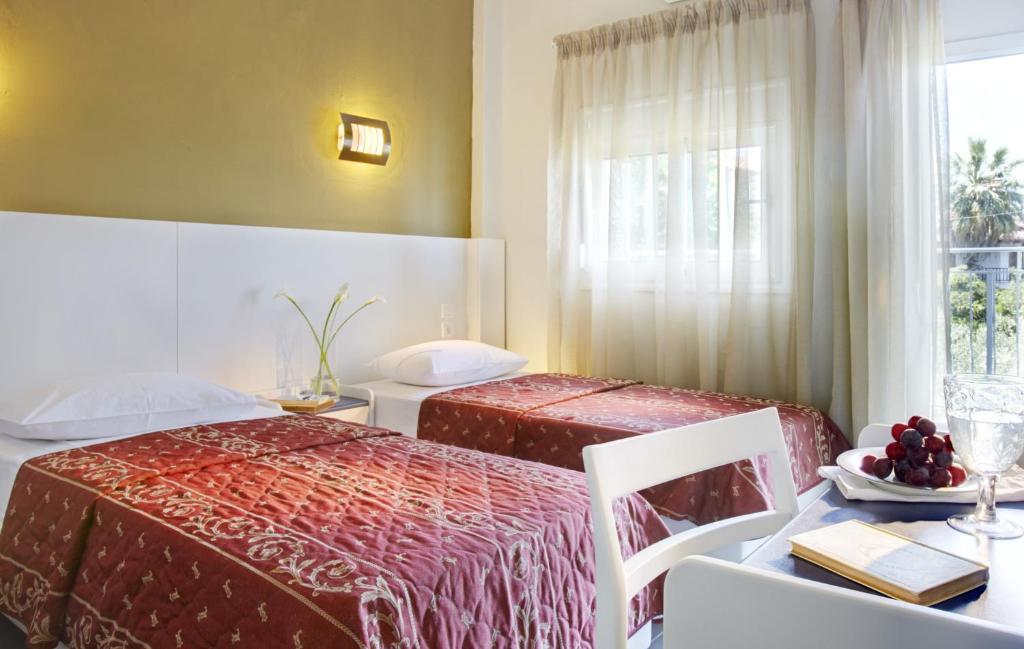 Postel nebo postele na pokoji v ubytování Hotel Alkyonis