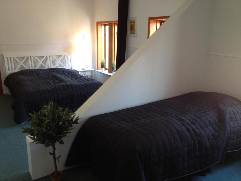 Postel nebo postele na pokoji v ubytování Kanns Hotel