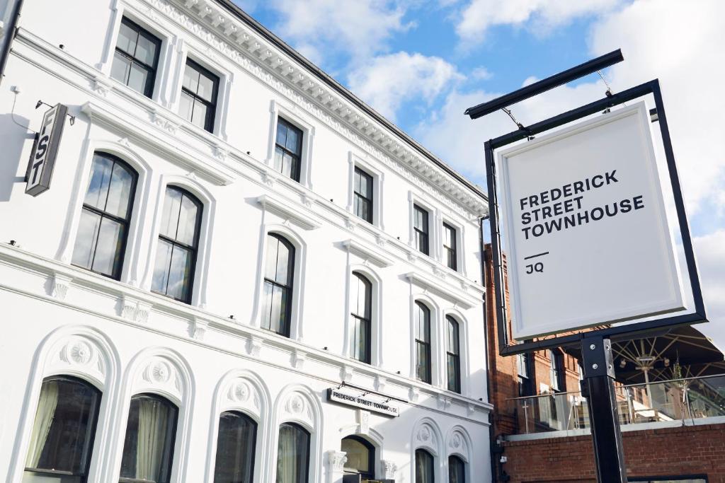 a sign in front of a large white building at Frederick Street Townhouse in Birmingham