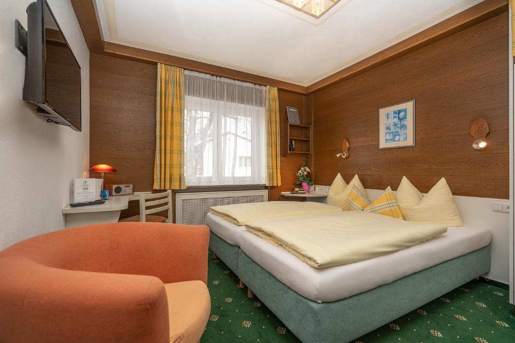 Postel nebo postele na pokoji v ubytování Hotel Sonnenspitz ***