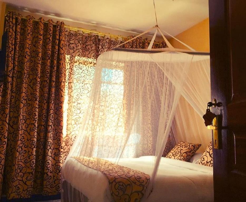 Postel nebo postele na pokoji v ubytování Hotel Embassy