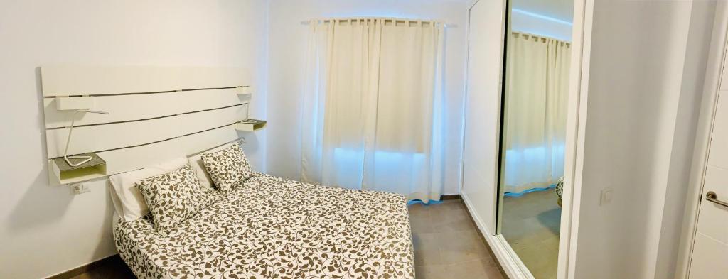 Postel nebo postele na pokoji v ubytování Apartamentos Zalabar