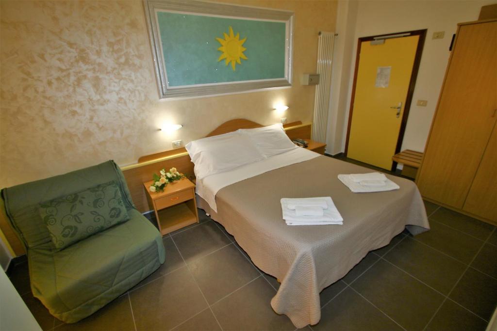 Postel nebo postele na pokoji v ubytování Hotel De Amicis