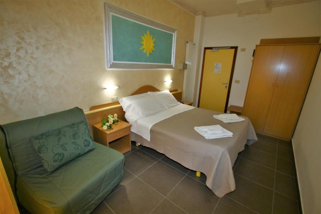 Postel nebo postele na pokoji v ubytování Hotel De Amicis