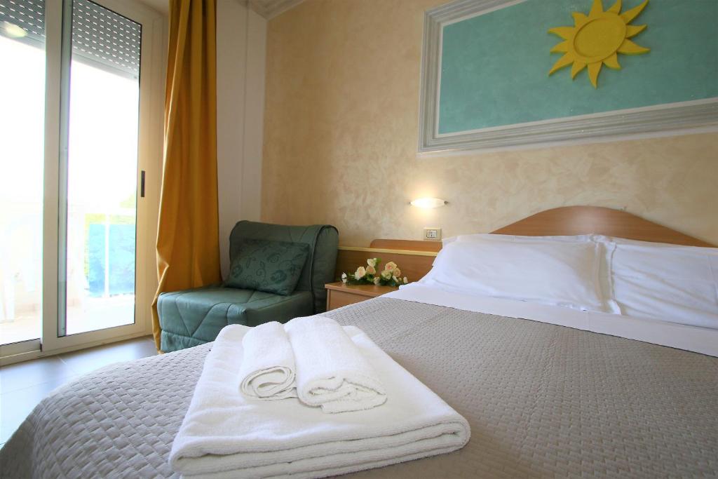 Postel nebo postele na pokoji v ubytování Hotel De Amicis