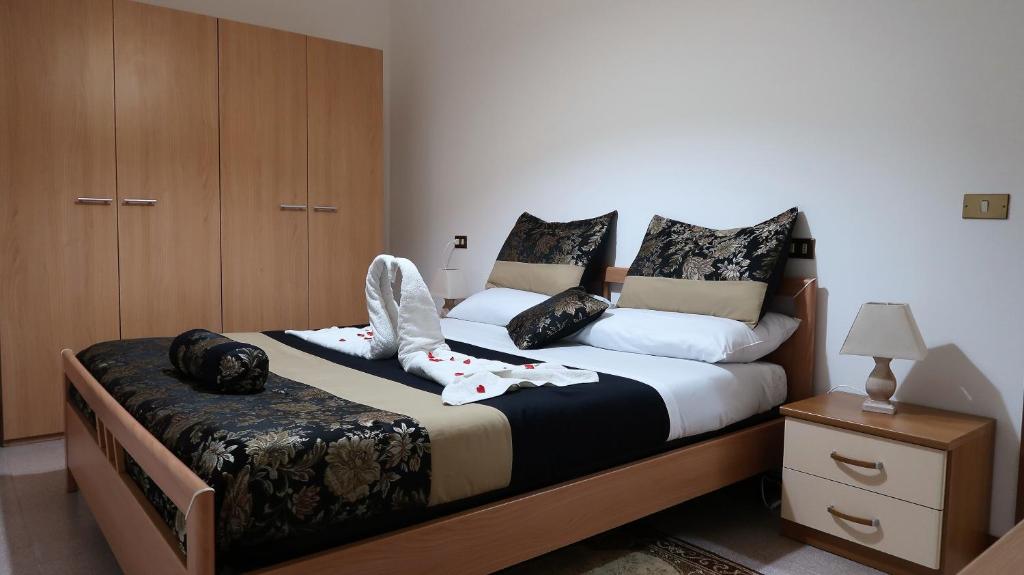 Säng eller sängar i ett rum på Appartamento Gioia (piano terra)