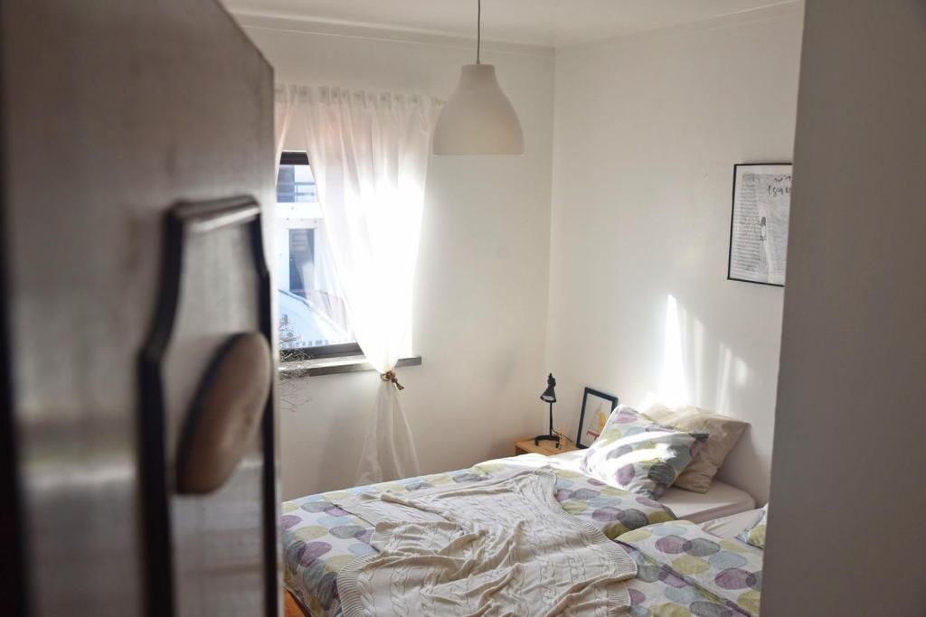 Postel nebo postele na pokoji v ubytování Surf House Peniche
