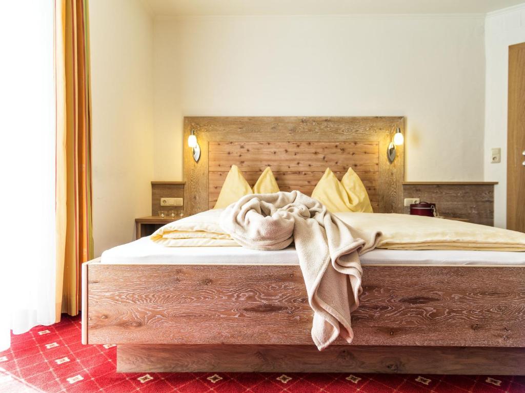 Postel nebo postele na pokoji v ubytování Pension Appartements Gabriele