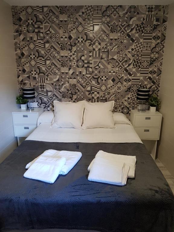Postel nebo postele na pokoji v ubytování Apartamentos Sueños de Toledo