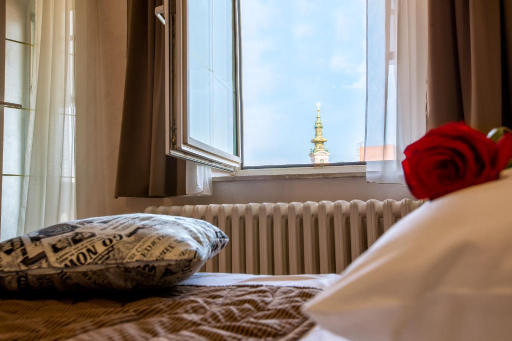 Postel nebo postele na pokoji v ubytování Hotel Fontana