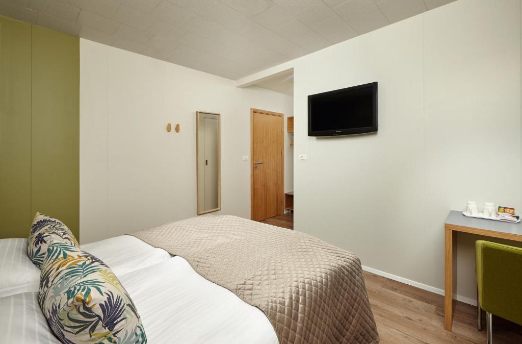 Postel nebo postele na pokoji v ubytování Hotel Klaustur