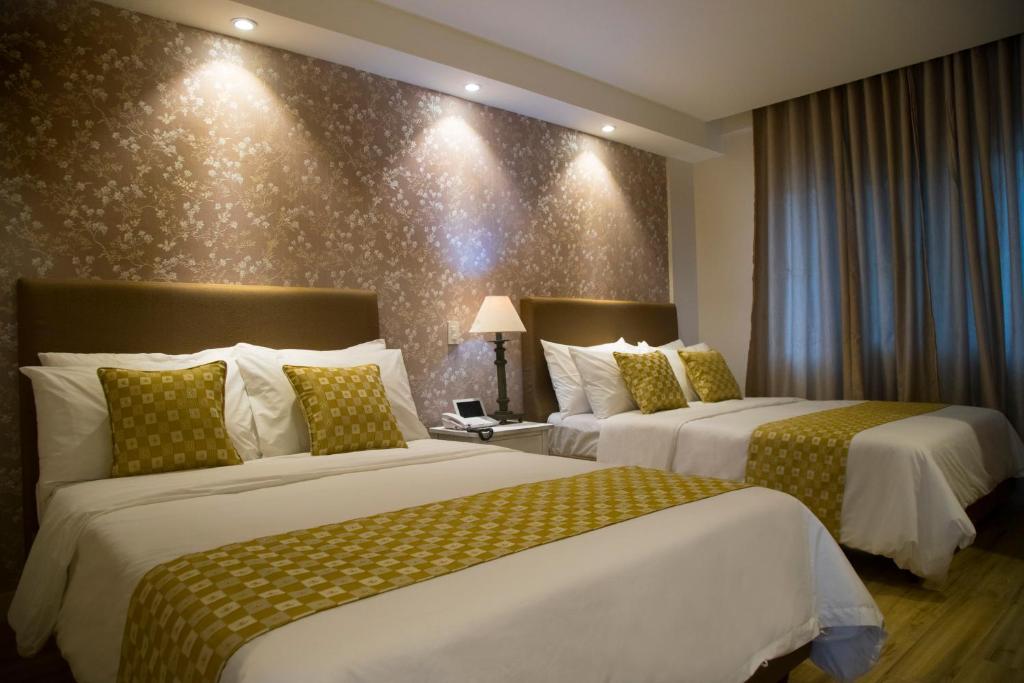 Postel nebo postele na pokoji v ubytování Sola Hotel