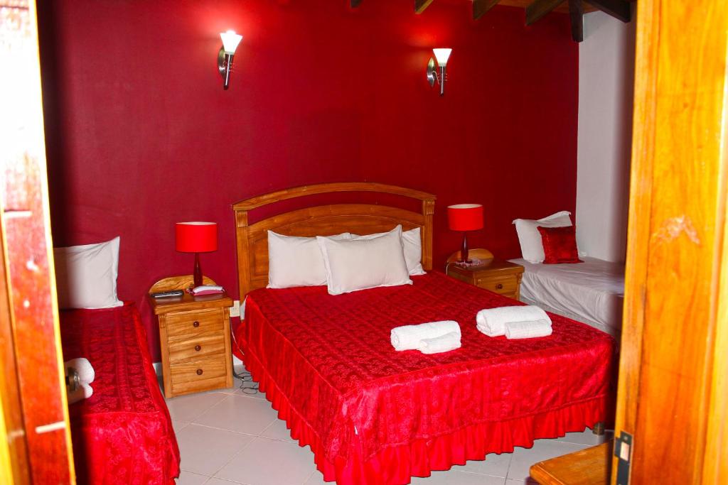 Ένα ή περισσότερα κρεβάτια σε δωμάτιο στο Ross Char Hotel