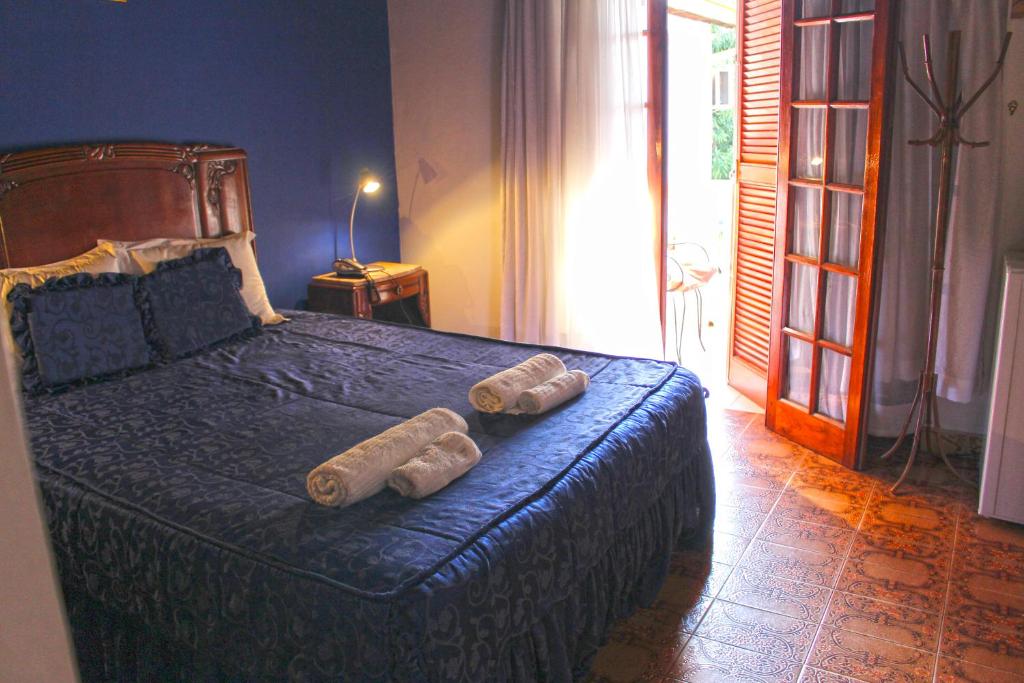 Ένα ή περισσότερα κρεβάτια σε δωμάτιο στο Ross Char Hotel