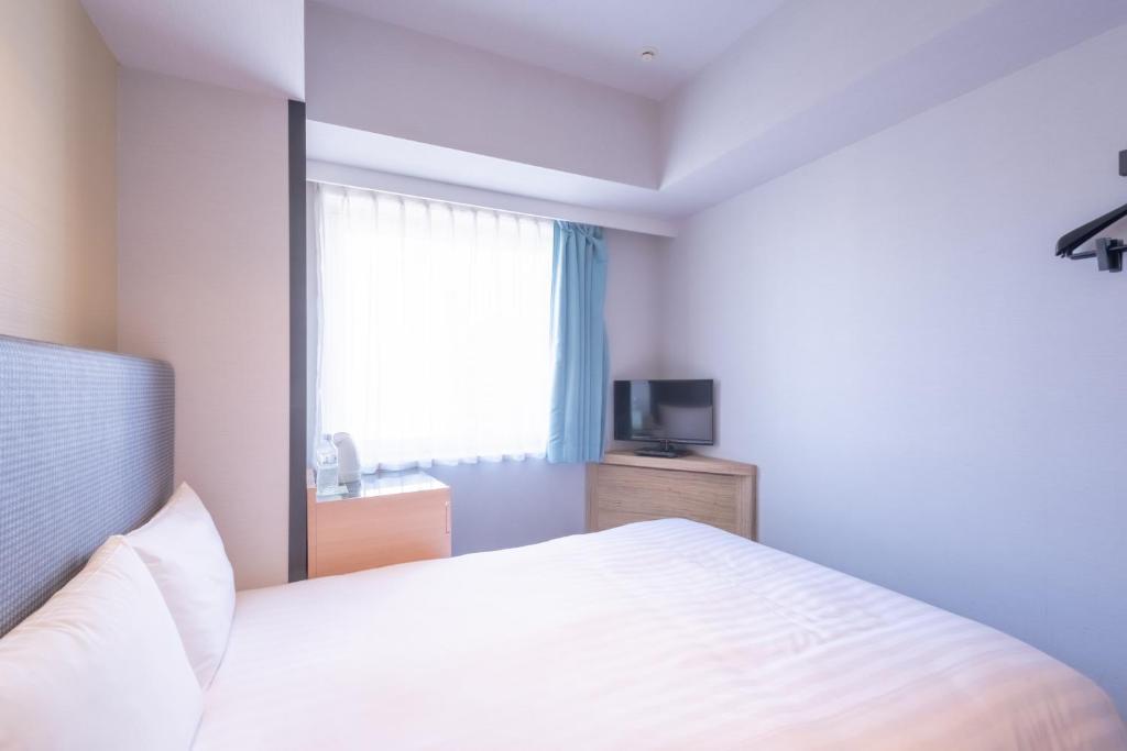 TV a/nebo společenská místnost v ubytování E Hotel Higashi Shinjuku