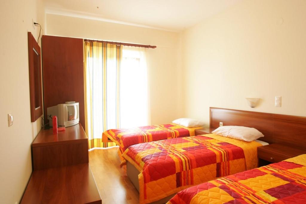 Postel nebo postele na pokoji v ubytování Hotel Metropole