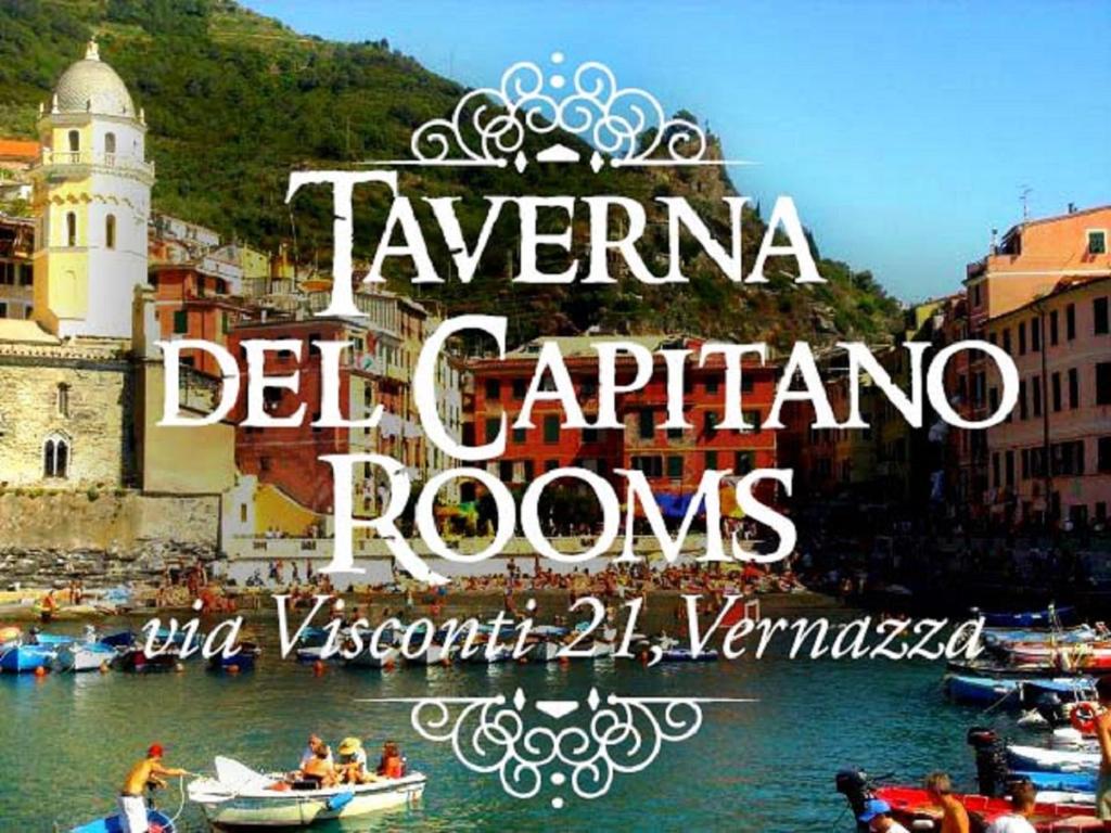 a group of people in boats in the water at Taverna del Capitano Rooms in Vernazza