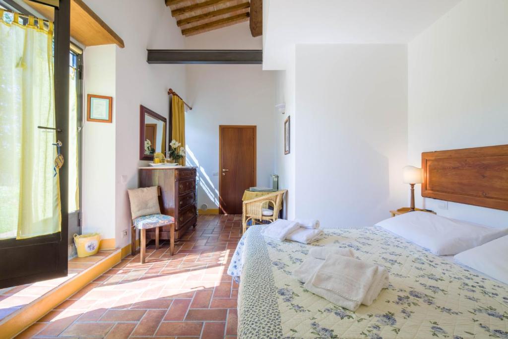 Postel nebo postele na pokoji v ubytování Ancora del Chianti