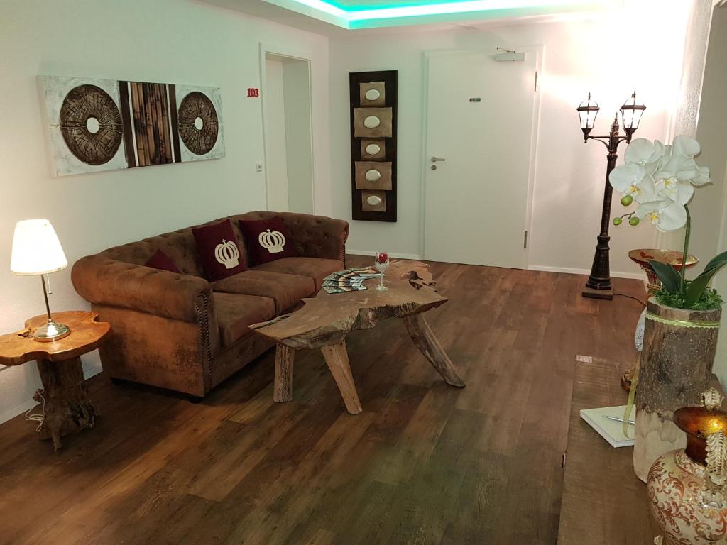 a living room with a couch and a coffee table at Gasthof Krone in Adelberg