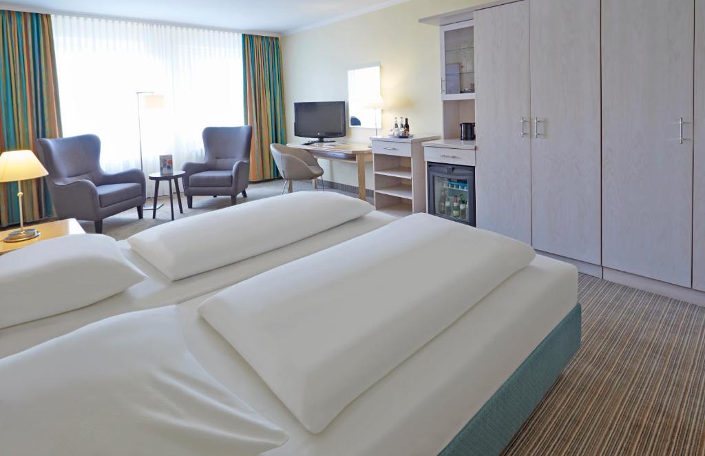 Postel nebo postele na pokoji v ubytování Upstalsboom Parkhotel