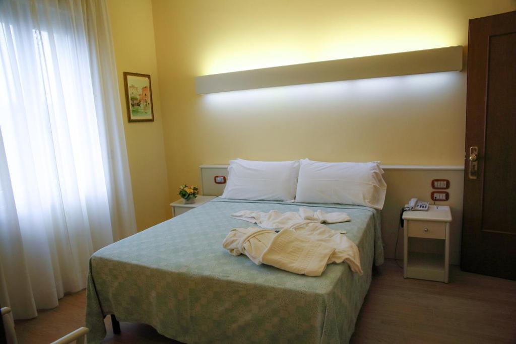Postel nebo postele na pokoji v ubytování Hotel Terme Vena D'Oro