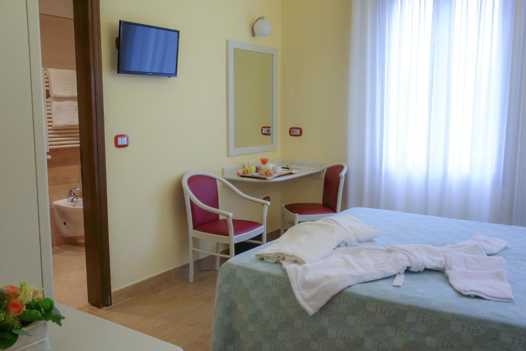 Postel nebo postele na pokoji v ubytování Hotel Terme Vena D'Oro