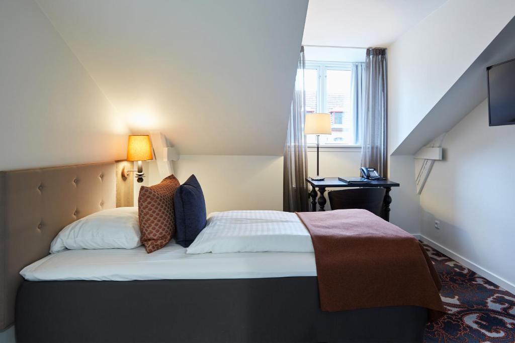 Postel nebo postele na pokoji v ubytování Hotel Vejlefjord