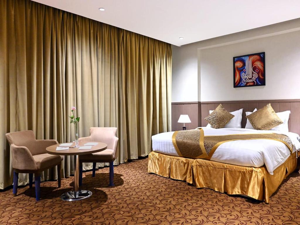 Postel nebo postele na pokoji v ubytování Batoul Ajyad Hotel