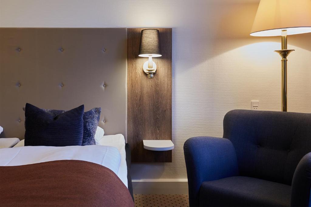 Postel nebo postele na pokoji v ubytování Hotel Vejlefjord