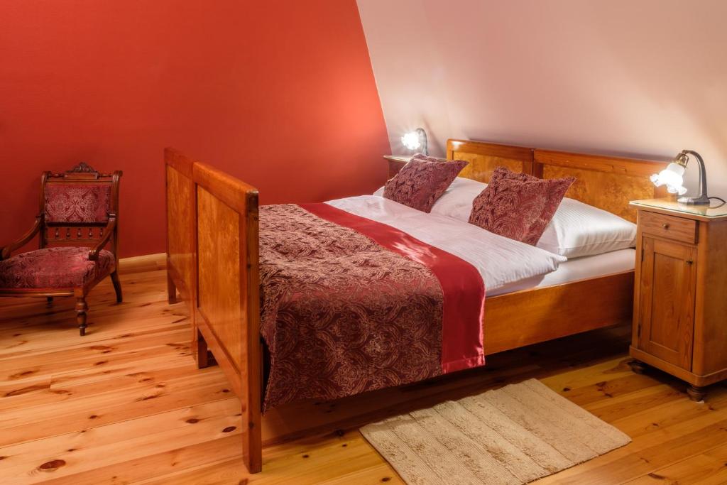 A bed or beds in a room at Boutique hotel Pracháreň