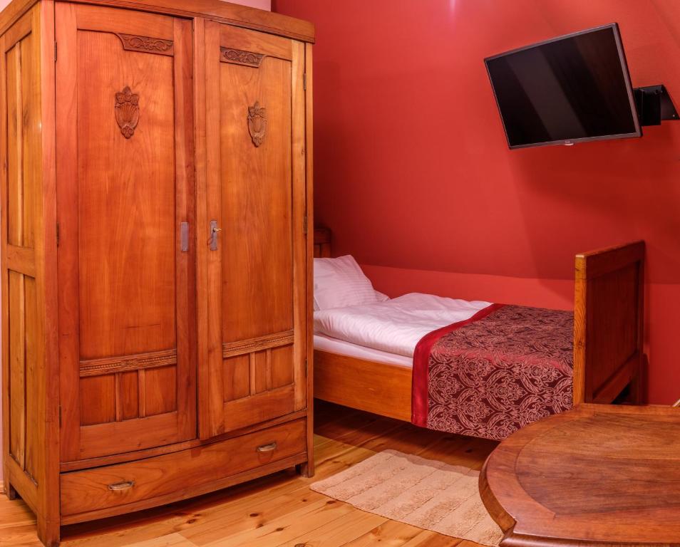 A bed or beds in a room at Boutique hotel Pracháreň