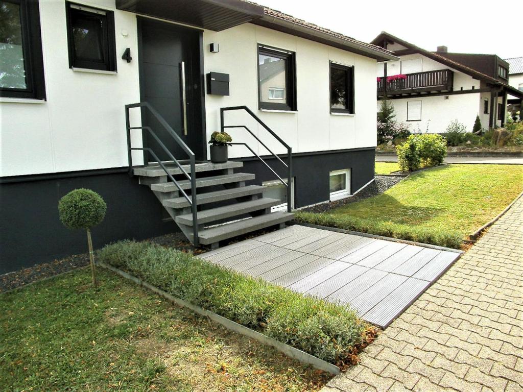a house with a walkway in front of it at Mergl's in Bad Schonborn