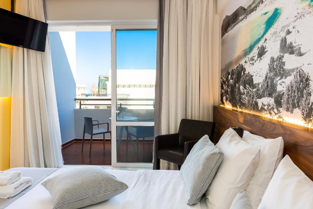 Postel nebo postele na pokoji v ubytování Atrium Ambiance Hotel