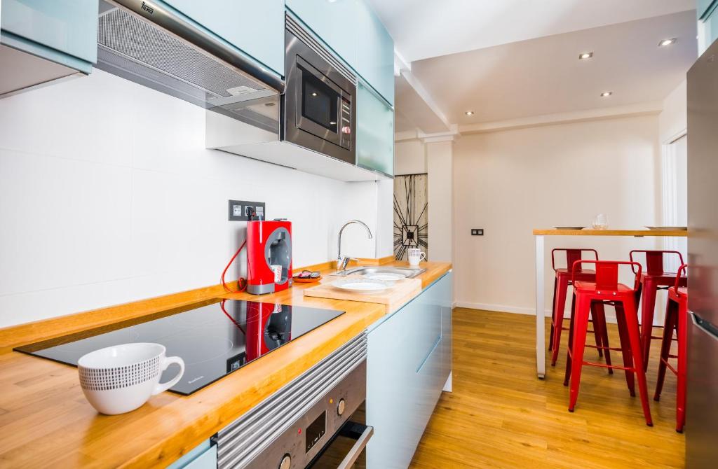 Kuchyň nebo kuchyňský kout v ubytování Expoholidays-Rueda Lopez apartamento de lujo