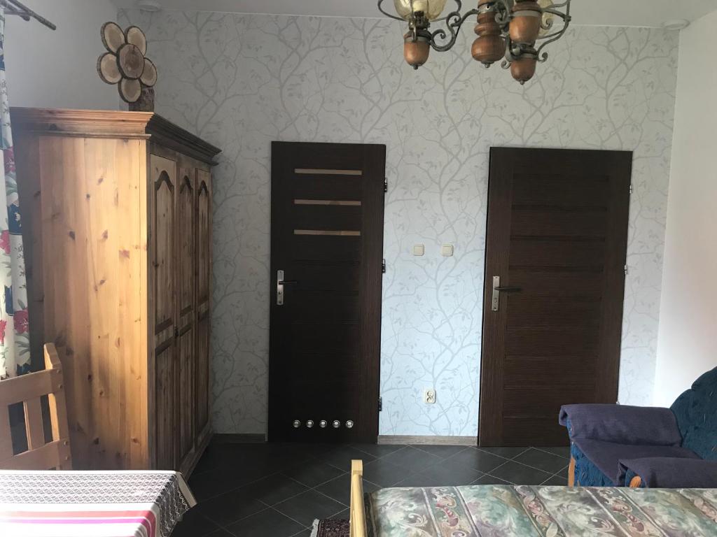 Postel nebo postele na pokoji v ubytování Hubertówka