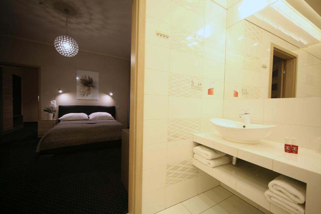 Posteľ alebo postele v izbe v ubytovaní Hotel Seven 7