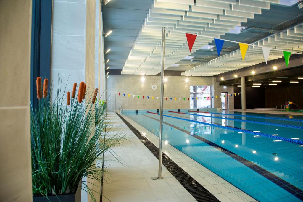 a large swimming pool in a large building at Paide SPA Hotell in Paide