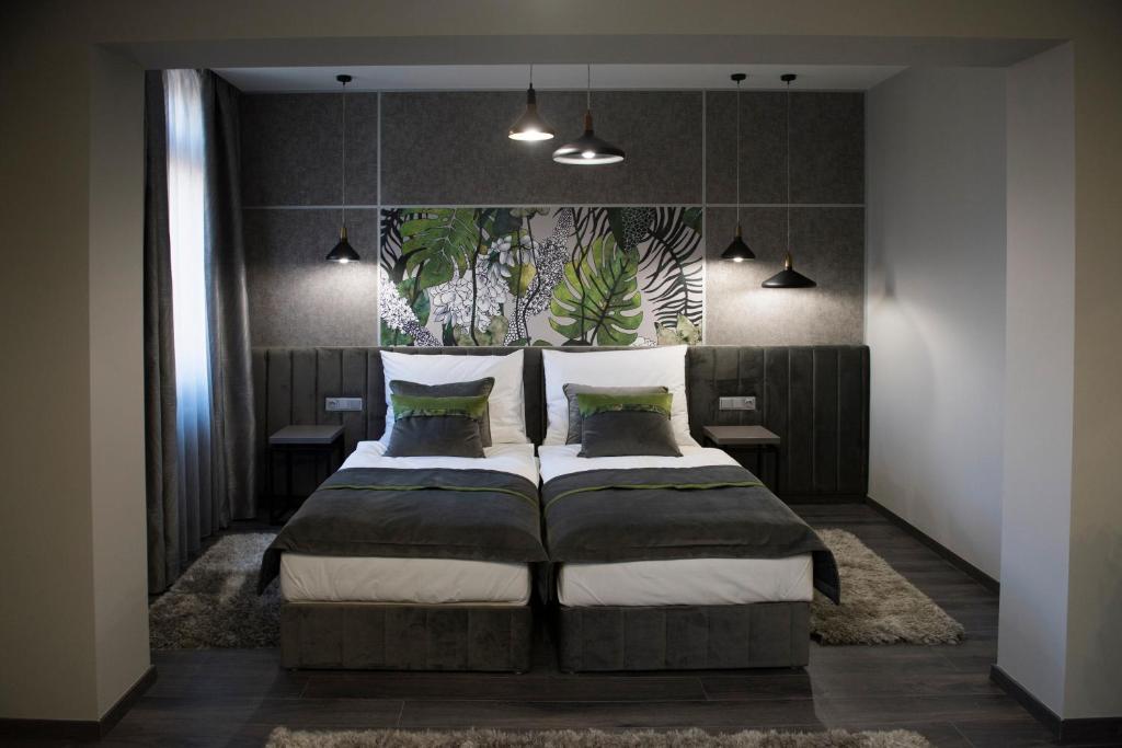 Posteľ alebo postele v izbe v ubytovaní Hotel Central