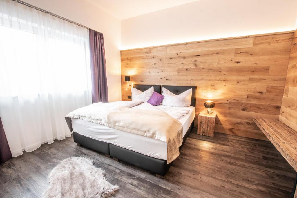 Postel nebo postele na pokoji v ubytování Apartklusiv Kaltenbach