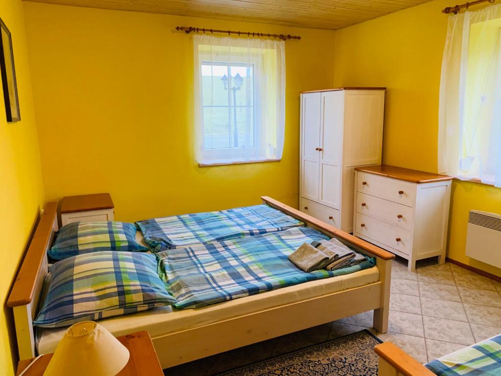 Postel nebo postele na pokoji v ubytování Penzion Rozalie