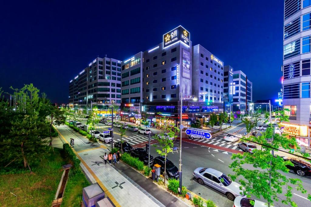 a city street with cars parked in front of a building at Guwol Hotel in Incheon