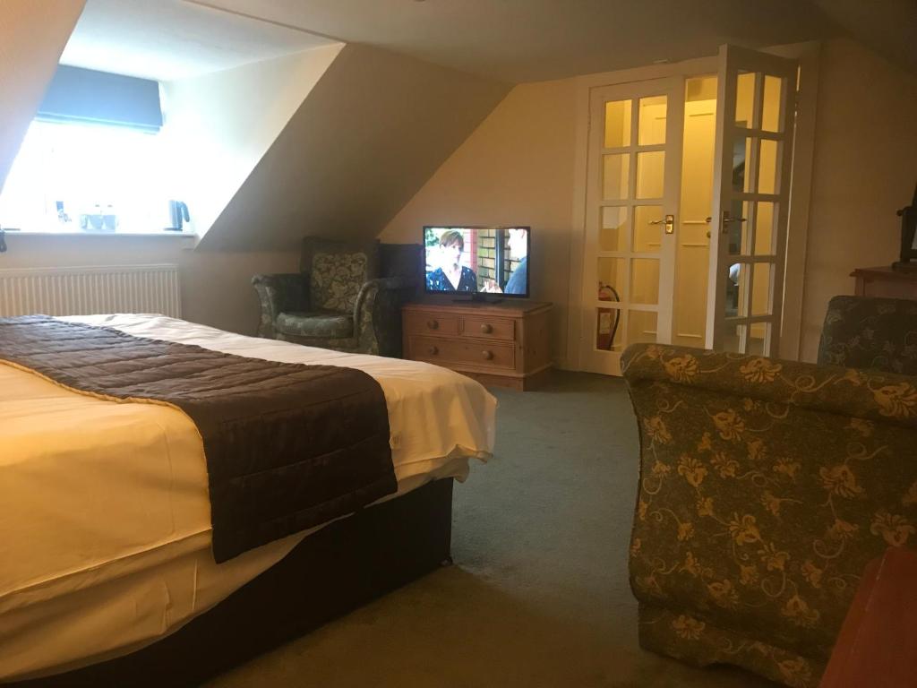 TV a/nebo společenská místnost v ubytování Creebridge House Hotel