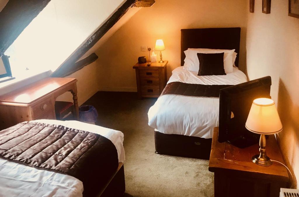 Postel nebo postele na pokoji v ubytování Creebridge House Hotel