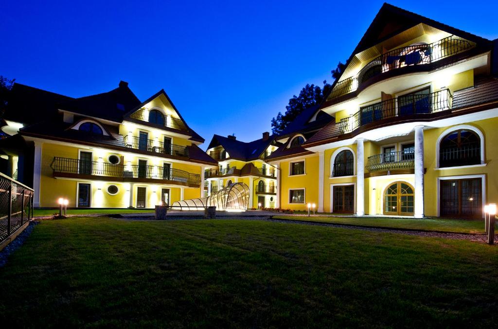 a large building with a lawn in front of it at Stella Di Mare in Zakopane