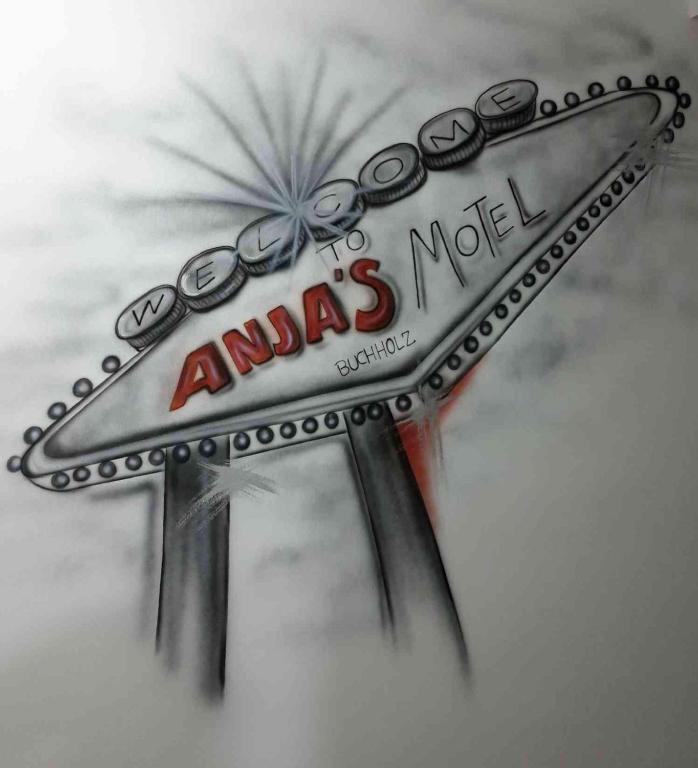 a sign for an amas motel on a wall at ANJA'S motel in Bruchmühlbach-Miesau